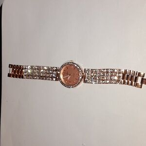 Rosetone watch with crystals.